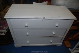 A white painted chest of 3 drawers, 46" long x 35" high x 19" deep.