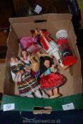 A quantity of costume dolls.