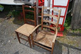 A low ladder back rush seated armchair plus a cane seated bedroom chair.