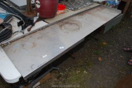 A large piece of edged stainless steel work top, 73" x 18".