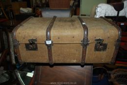 A canvas trunk with labels 29" wide.