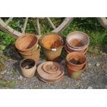 A small quantity of terracotta pots and saucers.