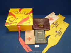 A Holy communion and New Testament set in red leather travelling pouch and a WWI German red cross
