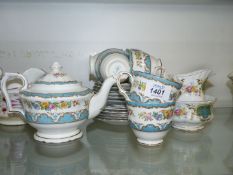 A pretty blue, white, and floral part Teaset by Crown Staffordshire including six cups, saucers,