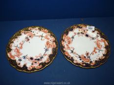 A pair of Royal Crown Derby Imari floral plates with gilt edges (painted 4945) approx. 9".