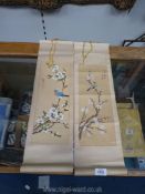 A pair of oriental hand painted pictures on paper of birds and blossoms,