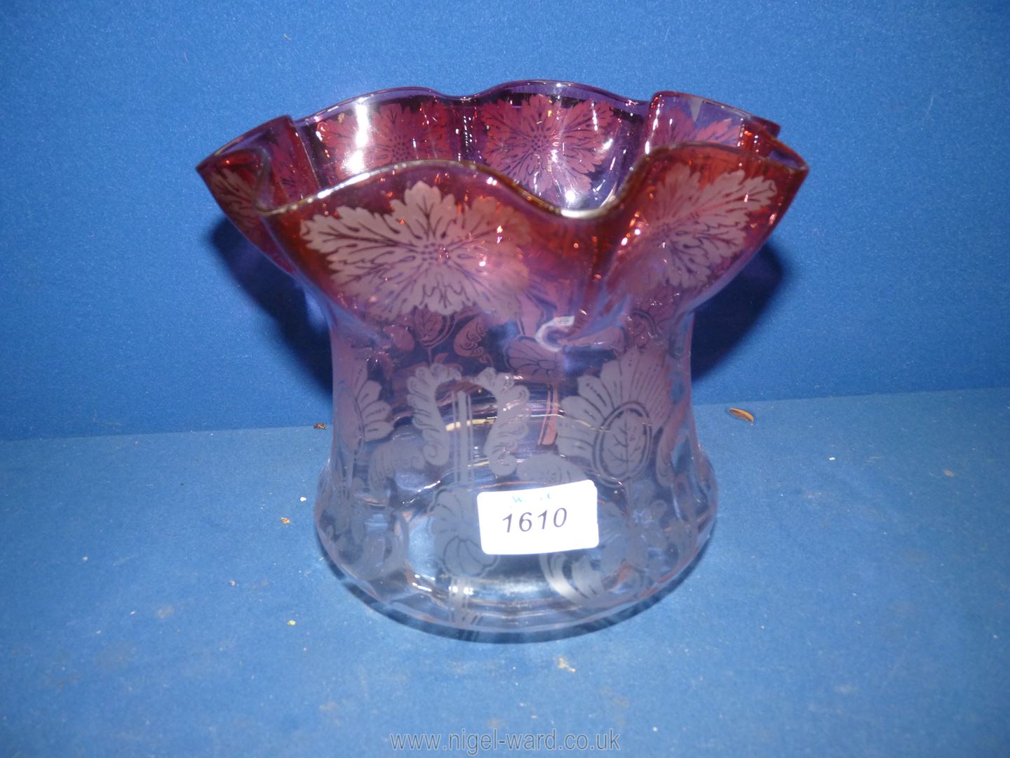 A Cranberry fluted glass light shade for an oil lamp, 7'' high x 8 1/4'' diameter.