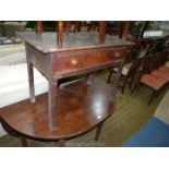 A circa 1800 peg-joyned Oak Side Table having a frieze drawer with turned knobs and standing on