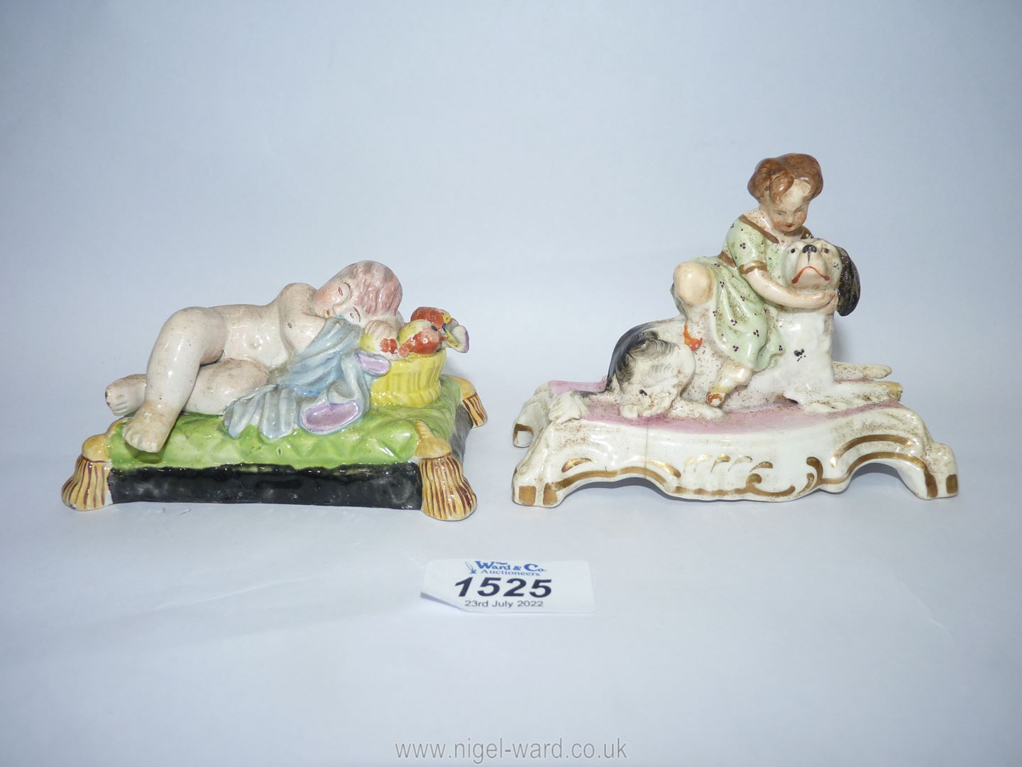 A Staffordshire porcelain figure of sleeping Putti on a green tasseled cushion, - Image 2 of 4