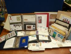 A box of Great Britain covers in First Day Cover albums plus loose and other commercial covers;