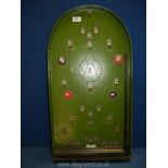 A vintage Bagatelle board (with spring loader), 29 1/2'' high x 15 1/4'' wide.