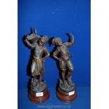 A pair of spelter bronzed figures by H.