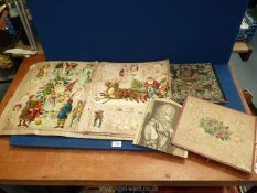 A fine leather bound Scrap Book containing cut-outs on fabric pages,