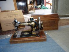 A wooden cased Singer sewing machine, no. 13625742.