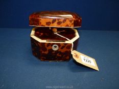 An octagonal turtle shell tea caddy, the lid opens to reveal a lidded compartment, with key, approx.