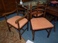A set of five contemporary dark Oak framed Dining Chairs including one carver having turned legs,