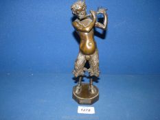 A bronze sculpture of Pan on octagonal base, signed Willy Russ with spiral stamp to base.