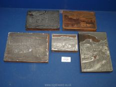 Five wood and metal printing blocks depicting villages, churches and landscapes.