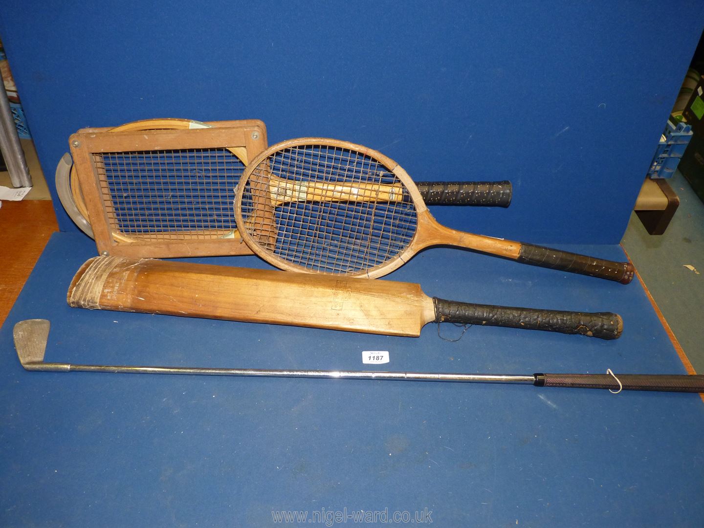 A Slazenger tennis racquet with press, Gray-Nicolls Ltd.