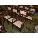 A set of eight including two carvers in Arts and Crafts design high back Mahogany framed Dining
