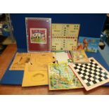 A quantity of board games including Draughts, Snakes & Ladders, Play the Game Book,