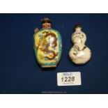 Two enamel oriental snuff bottles, with dragon decoration and character marks to base.