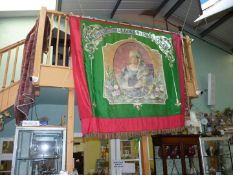 A large red and green Banner depicting Queen Victoria with 'Loyal Victoria Lodge, No. 029 L.O.A.S.A.