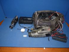 A Ferguson FC54 VHS-C Video Camera with various accessories, A Canon BC-E1 Battery Coupler,