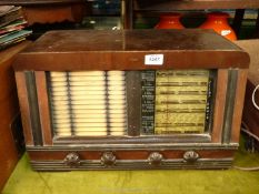A vintage Pilot radio with Bakelite knobs, 20 1/2" wide x 10 1/2" deep x 12 1/2" high.