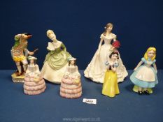 A quantity of figurines including a Royal Crown Derby 'Five' XL11 figure of a man in period dress,