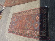 A red, green and blue ground Rug with star motifs to centre, worn, 6' long x 40'' wide.