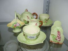 A Carlton ware green fox glove pattern Tea for one, plus a similar basket.