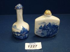 Two blue and white oriental snuff bottles with marks to base.