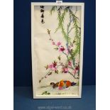 A framed oriental Embroidery depicting ducks on pond under a blossom tree,