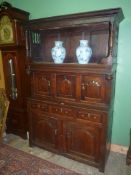 An unusual 18th century peg-joyned Oak Triadarn, the base with three frieze drawers,