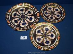 A pair of Royal Crown Derby Imari plates (painted 8211) approx. 7", plus another similar.