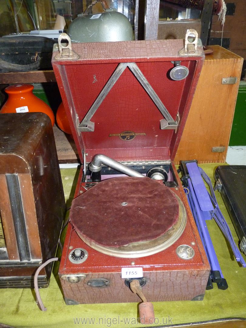 A 'Columbia Viva-tonal Grafonola' Gramophone in red textured case, supplied by Harrods, handle a/f.