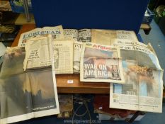 Two folders and quantity of loose newspapers for World War I and II and other historical events.
