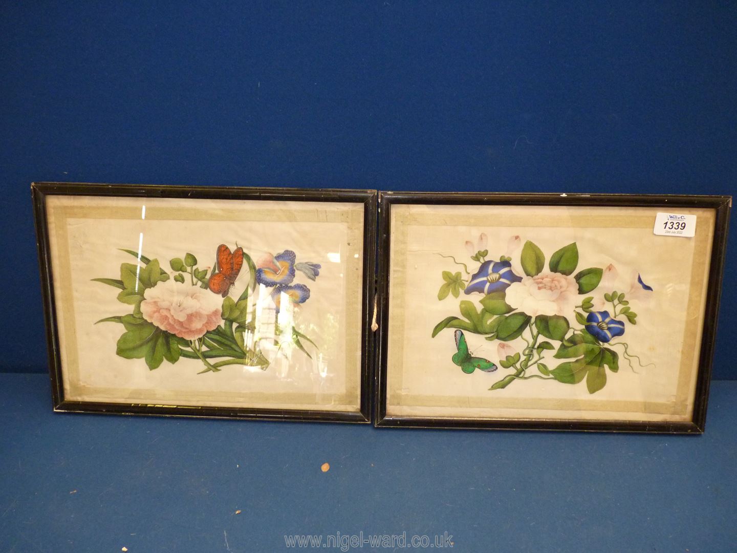 A pair of framed silk pictures with hand-painted flowers and butterflies,