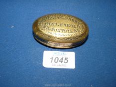 An oval brass tobacco/snuff box engraved 'William Parry, Euias Harold, Nr. Pontrilas',