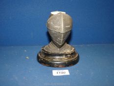 A novelty Knight helmet candle holder with lift up visor to snuff out candle, 5 1/2" tall x 5" wide.