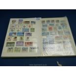 A stamp stock book with stamps from Newfoundland and Canada including eight stock cards with mint