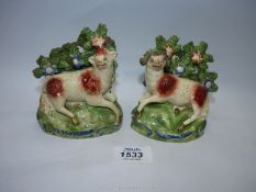 A pair of Staffordshire Sheep spill holders, 4 3/4'' high,