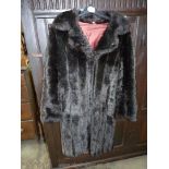 A luxury Barmink faux fur Coat by Dunbar in dark brown, size 14, 52% modaacrylic and 48% acrylic.