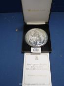 A "Jubilee Mint" cased Silver £10 coin, 10 oz., with certificate.
