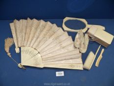 A Victorian bone and silk fan, Art Deco style hand mirror, child's hairbrush and comb,