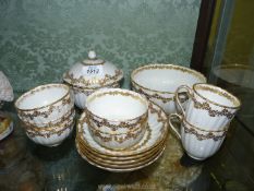 A small quantity of early Crown Derby teaware in white with gilt flower garland borders including 5