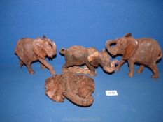 Three Ironwood hand carved African elephants, the largest being 16cm tall,