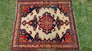 A cream ground birjand Persian rug decorated with large central medallion, floral borders, a/f.