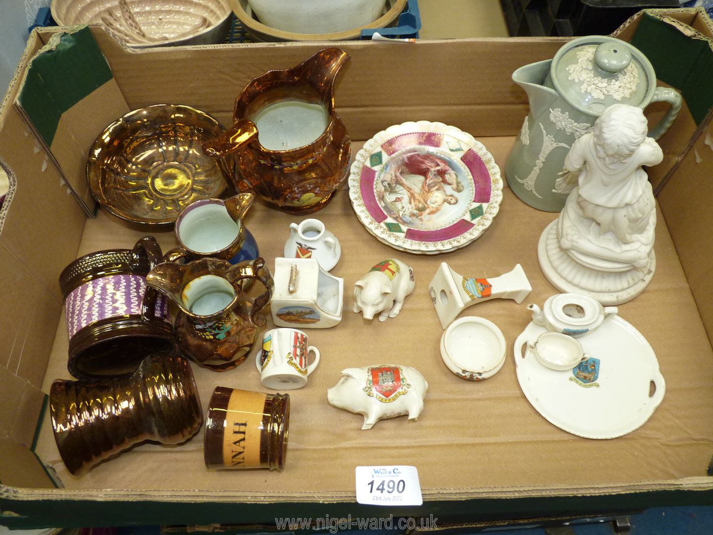 A quantity of china including lusterware mugs and jugs, souvenir ware including pigs,